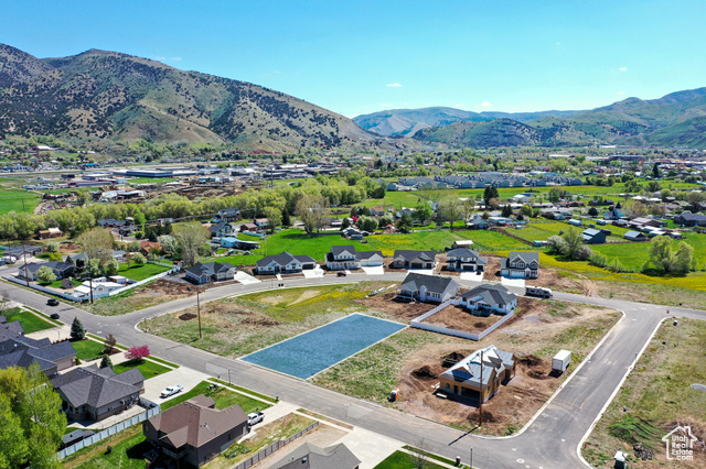 560 North 400 East, Unit 18 Morgan, UT 84050 - Photo 1 of 1 Aerial perspective of suburban area featuring a mountain backdrop