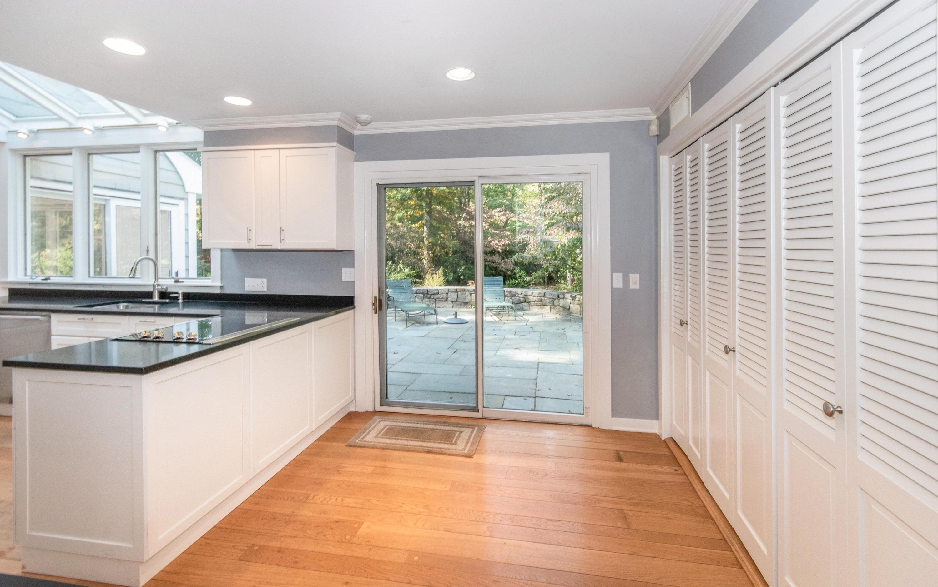 54 Huckleberry Hill Road New Canaan, CT 06840 - Photo 13 of 37 a view of a kitchen with a sink and cabinets