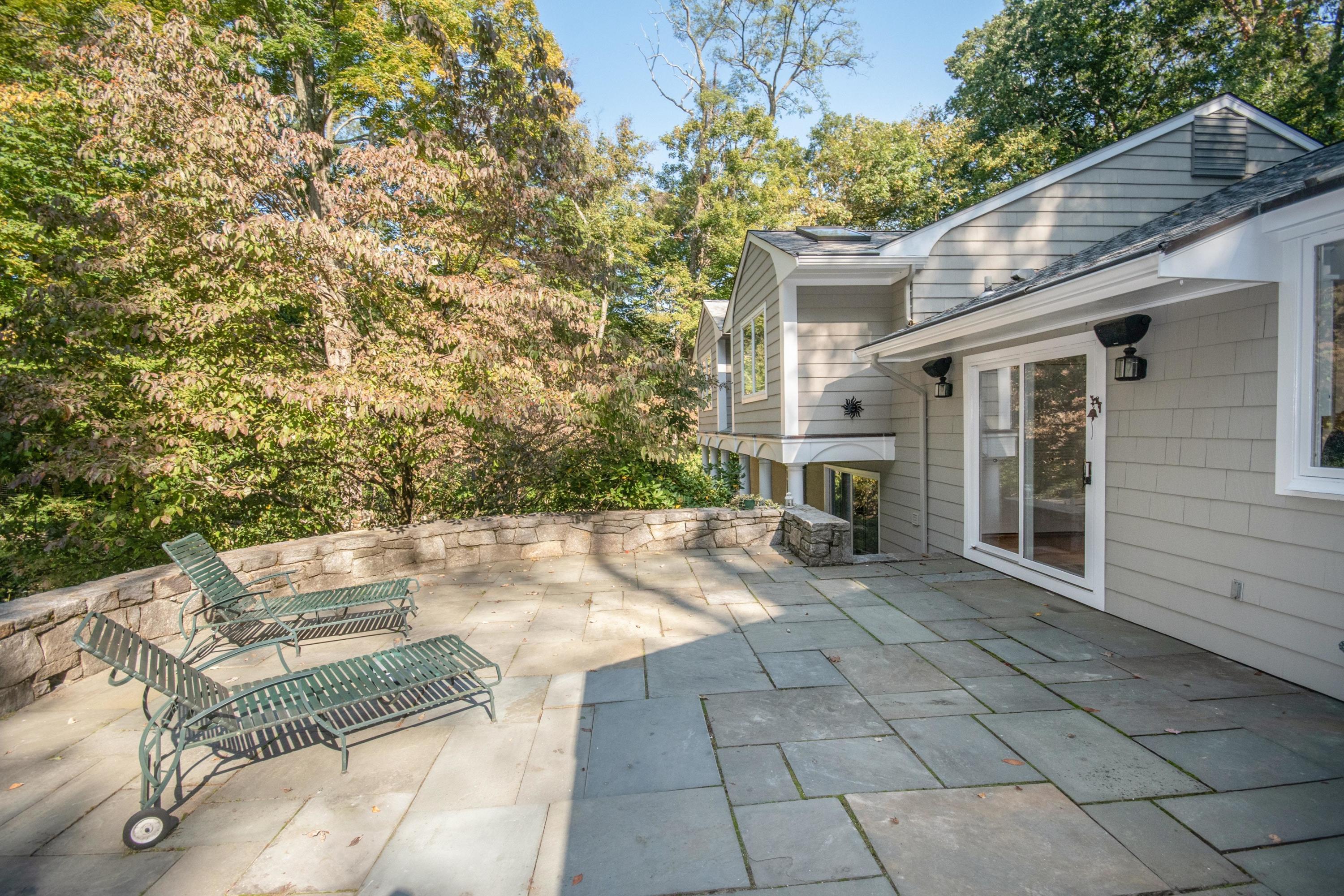 54 Huckleberry Hill Road New Canaan, CT 06840 - Photo 18 of 37 a view of house with yard