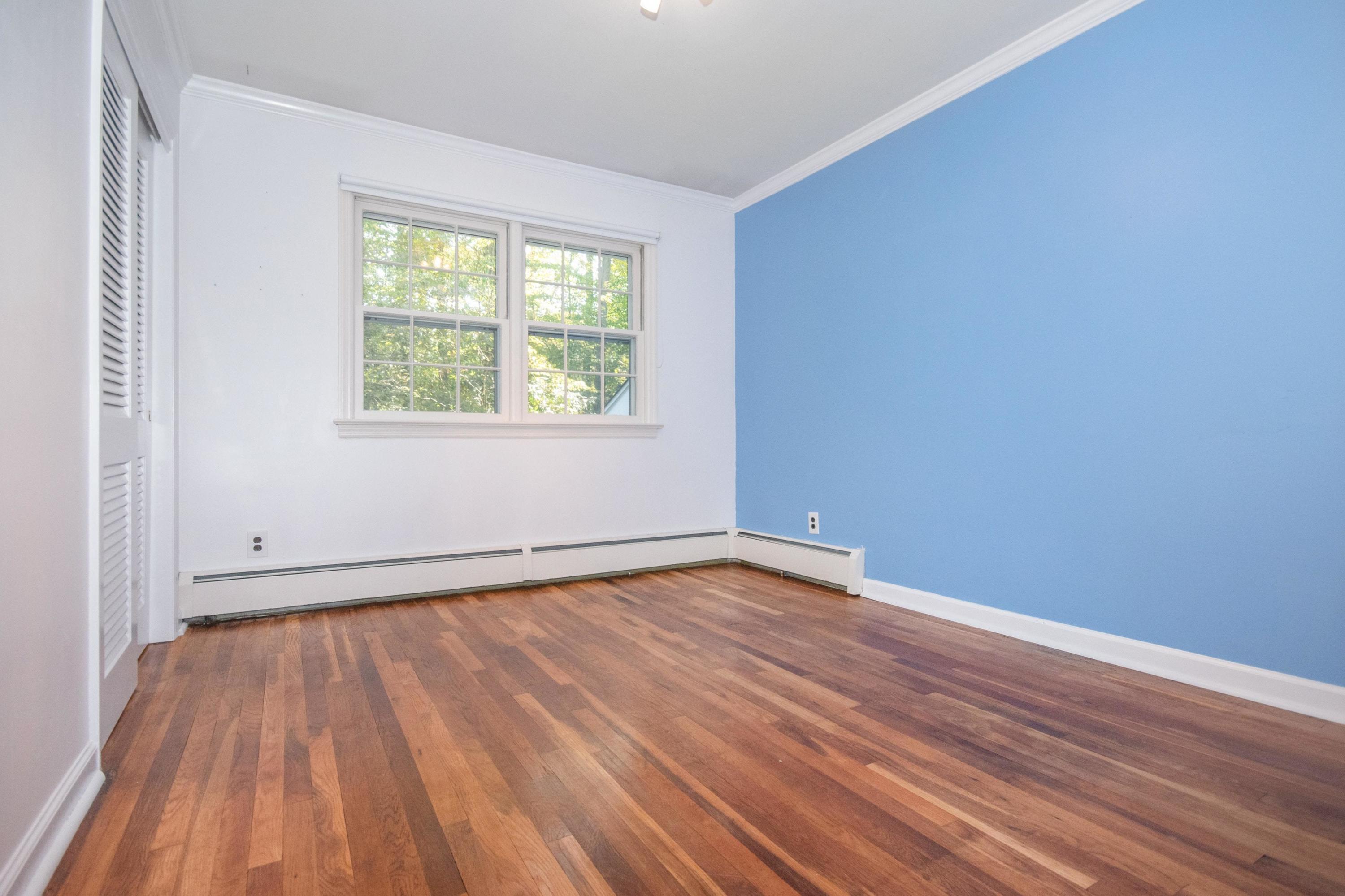 54 Huckleberry Hill Road New Canaan, CT 06840 - Photo 24 of 37 a view of an empty room with wooden floor and a window