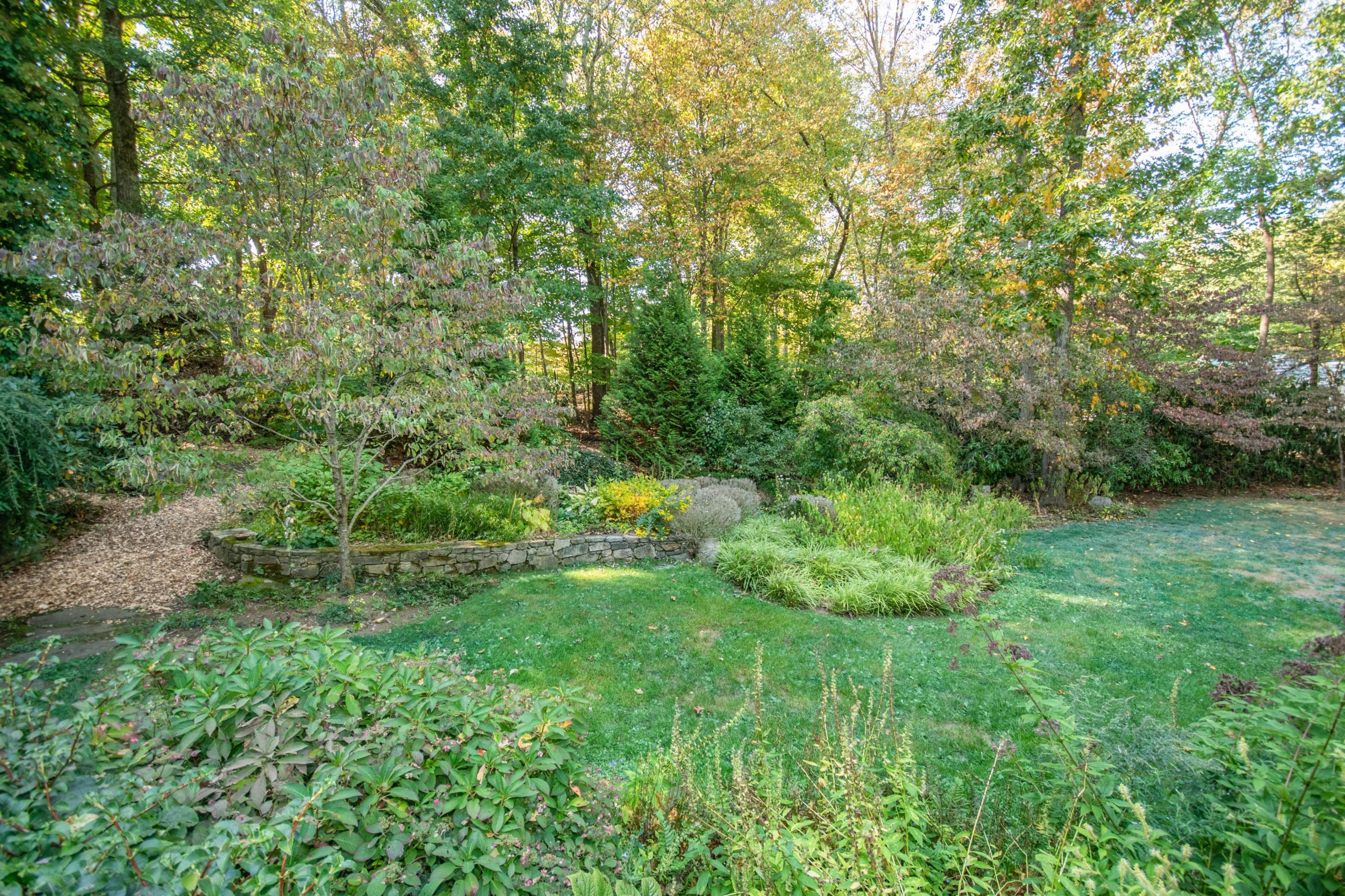 54 Huckleberry Hill Road New Canaan, CT 06840 - Photo 31 of 37 a view of yard with green space