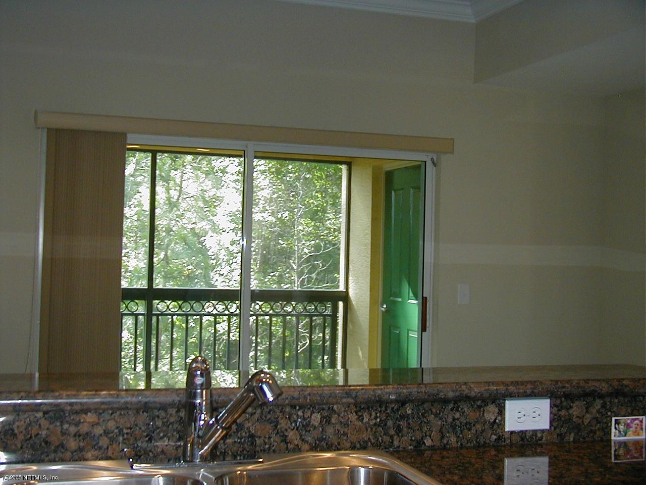 9745 Touchton Road, Unit 2424 Jacksonville, FL 32246 - Photo 7 of 7 Kitchen view to screened lanai