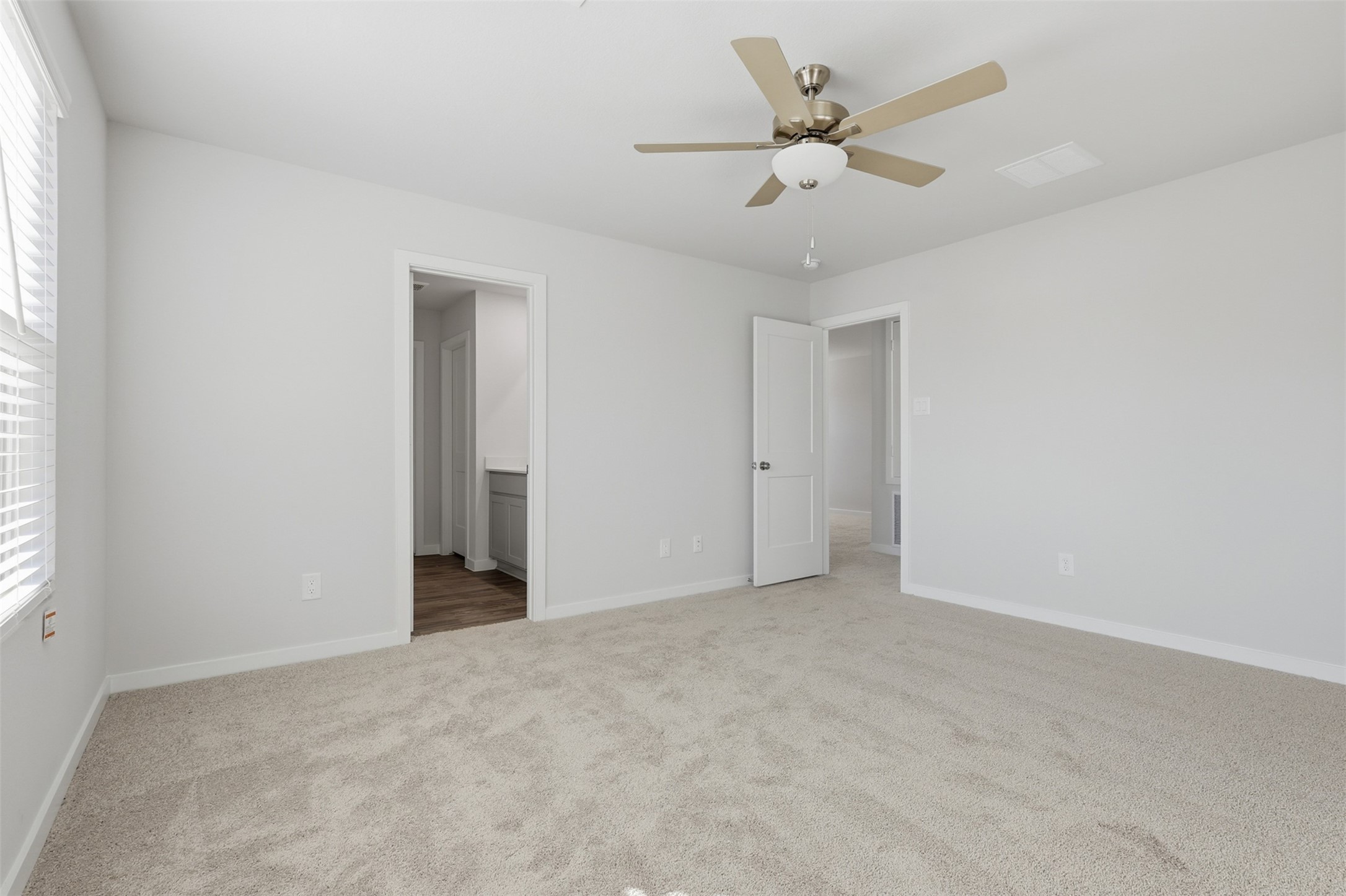 211 Brazen Forest Trail Magnolia, TX 77355 - Photo 6 of 14 an empty room with fan and windows