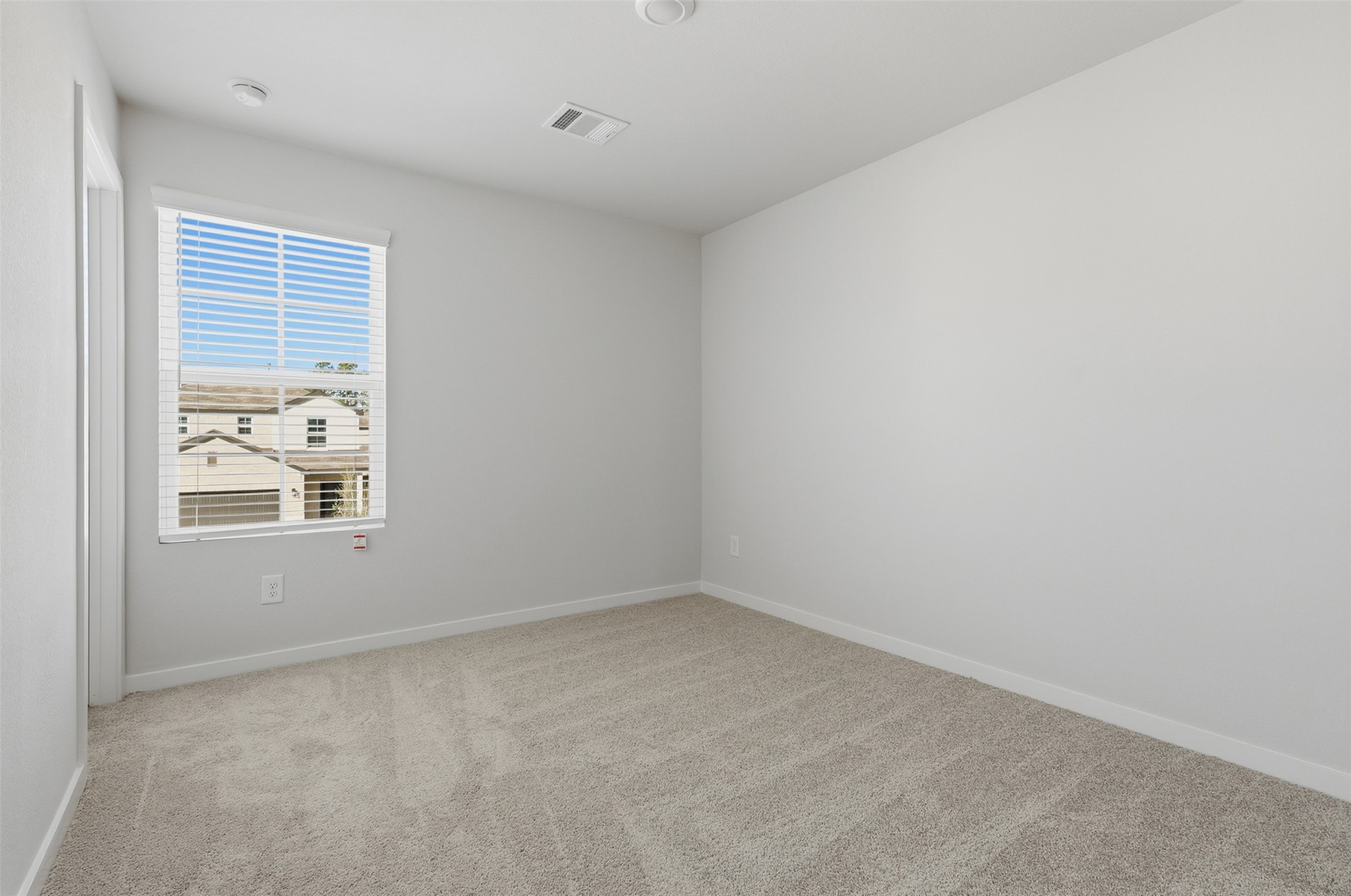 211 Brazen Forest Trail Magnolia, TX 77355 - Photo 9 of 14 an empty room with windows