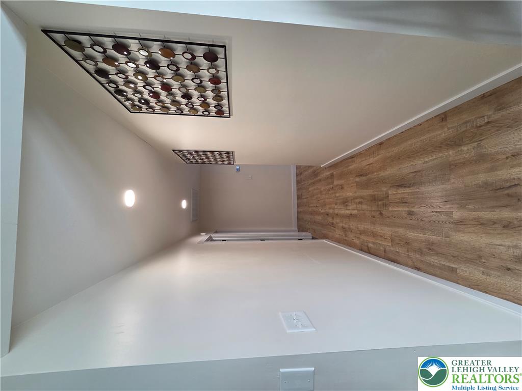 89 Short Ridge Road Albrightsville, PA 18210 - Photo 56 of 71 Warm wood flooring and clean white walls line this inviting hallway space.