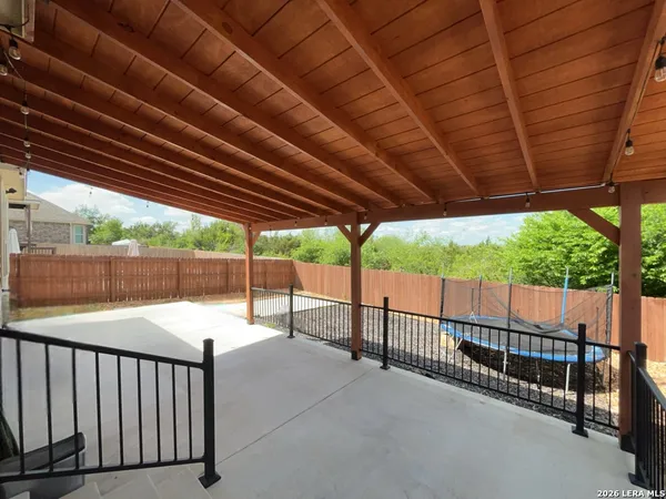 a view of a porch with furniture and a grill