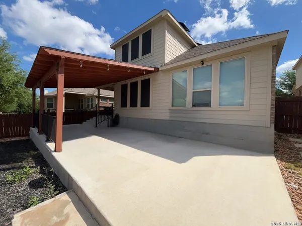 a house with garden in front of it