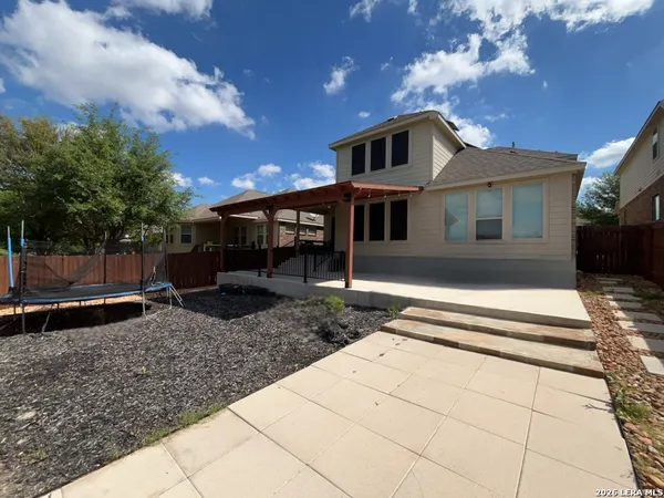 a sign that is in front of flowers