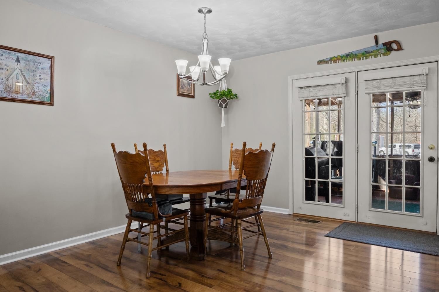 41 Golden Pond Circle Holladay, TN 38341 - Photo 16 of 42 a view of a dining room with furniture wooden floor and chandelier