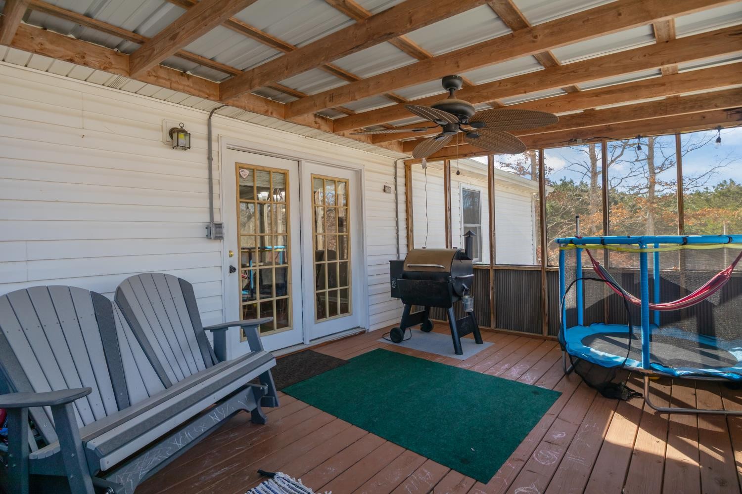 41 Golden Pond Circle Holladay, TN 38341 - Photo 17 of 42 a view of a porch with furniture and a yard