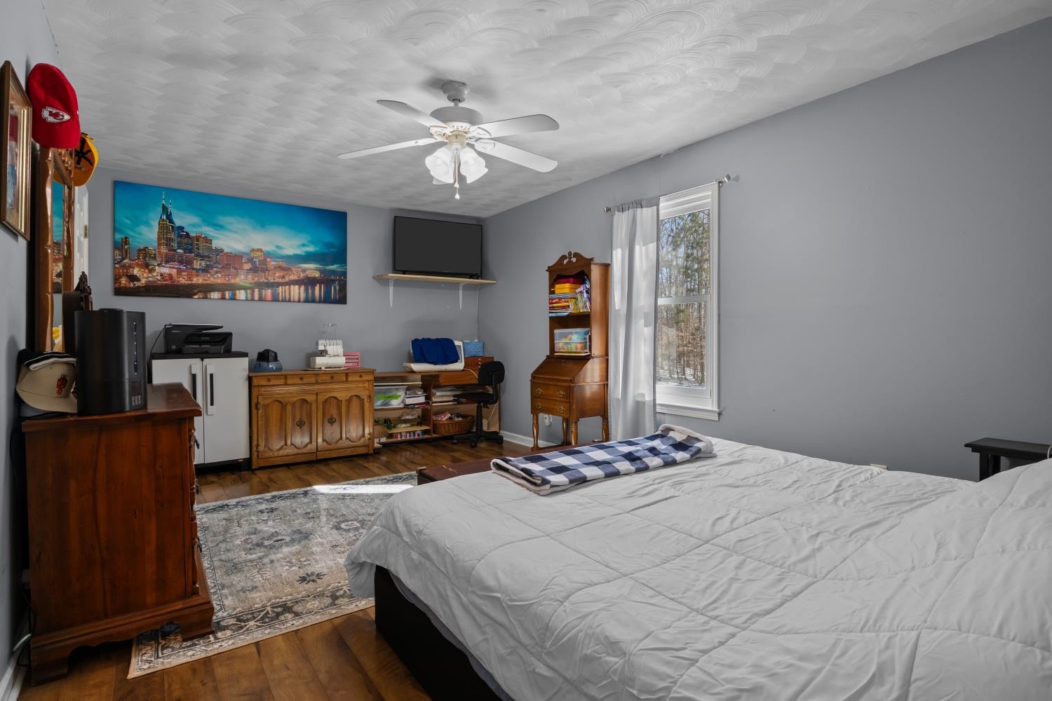 41 Golden Pond Circle Holladay, TN 38341 - Photo 19 of 42 a bedroom with furniture and a chandelier