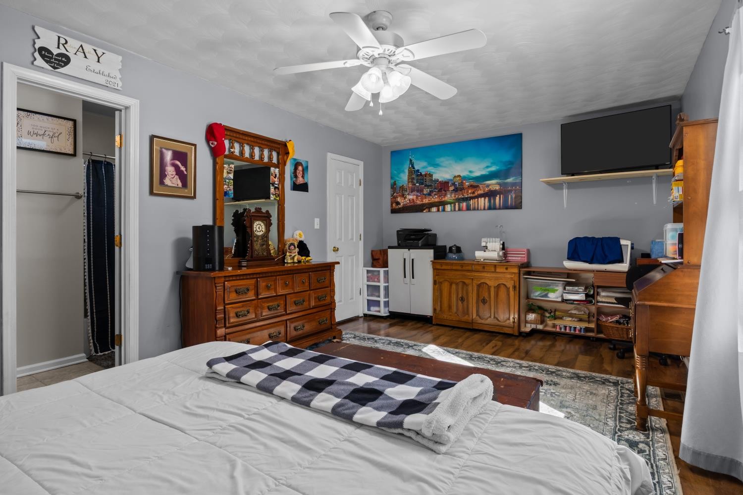 41 Golden Pond Circle Holladay, TN 38341 - Photo 21 of 42 a bedroom with a bed and dresser