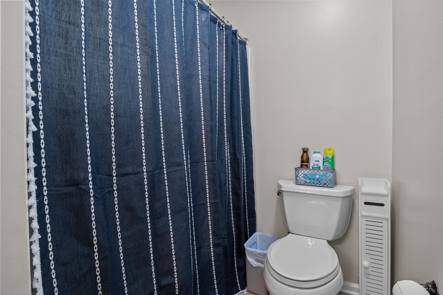 41 Golden Pond Circle Holladay, TN 38341 - Photo 23 of 42 a white toilet sitting next to a bathroom sink