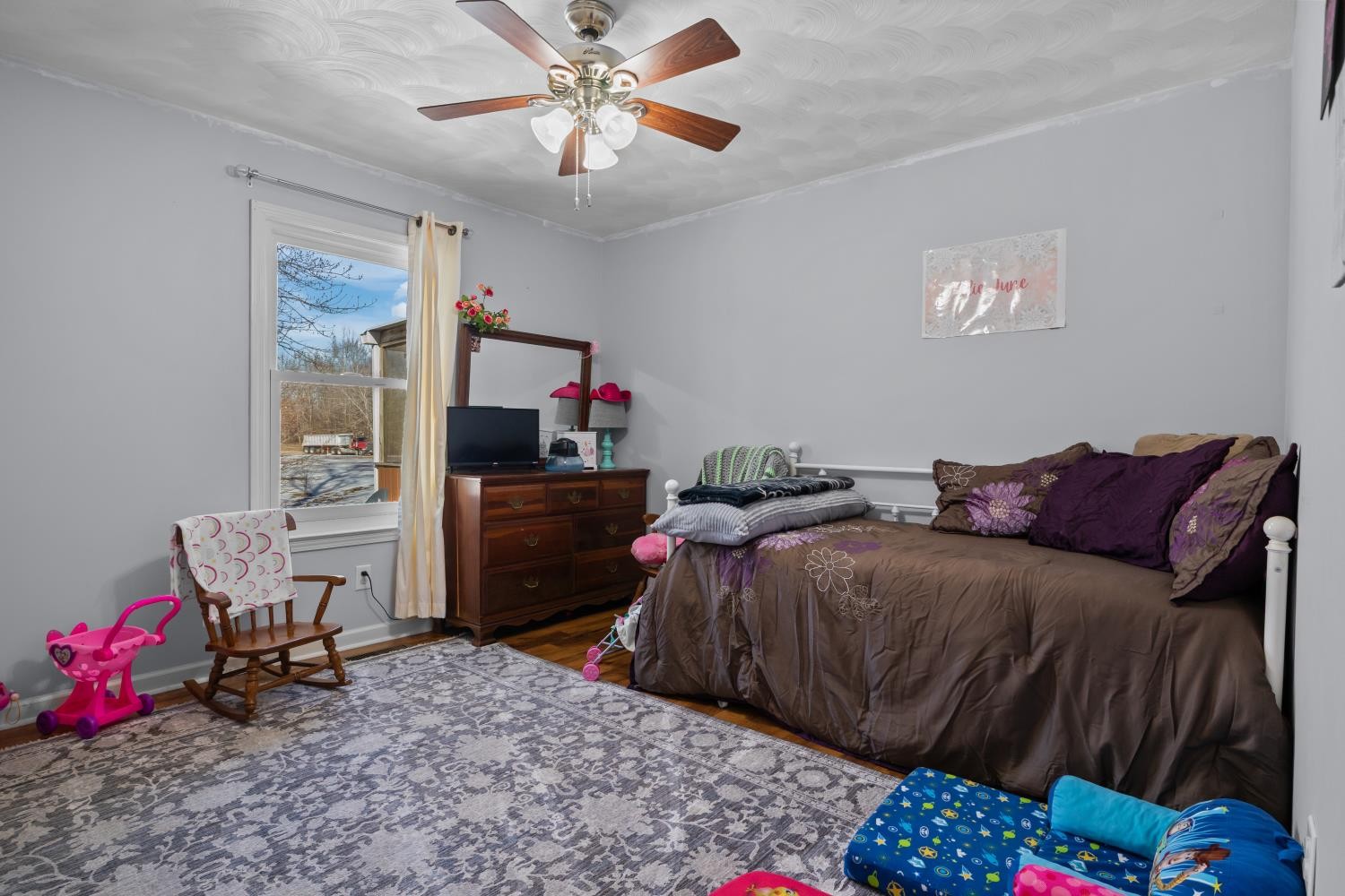 41 Golden Pond Circle Holladay, TN 38341 - Photo 27 of 42 a bedroom with a bed dresser and a window