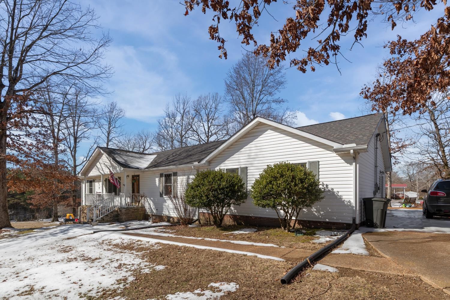 41 Golden Pond Circle Holladay, TN 38341 - Photo 3 of 42 a front view of a house with a yard and garage