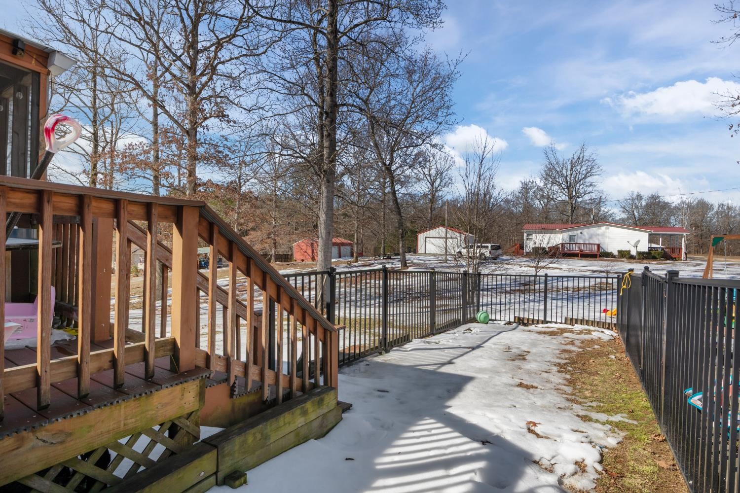 41 Golden Pond Circle Holladay, TN 38341 - Photo 33 of 42 a view of a patio with couches chairs and wooden floor