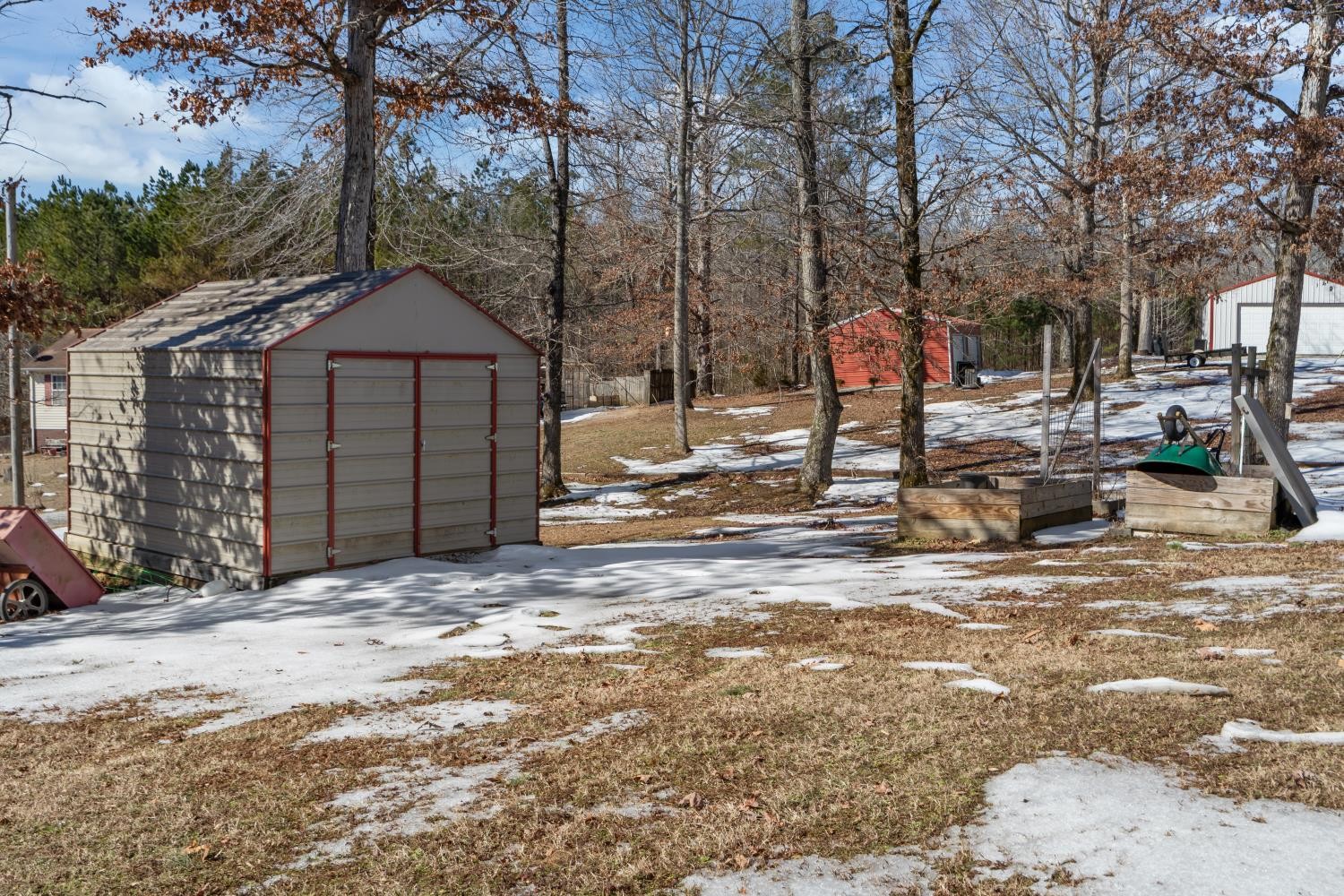 41 Golden Pond Circle Holladay, TN 38341 - Photo 37 of 42 a front view of a house with a yard covered in snow