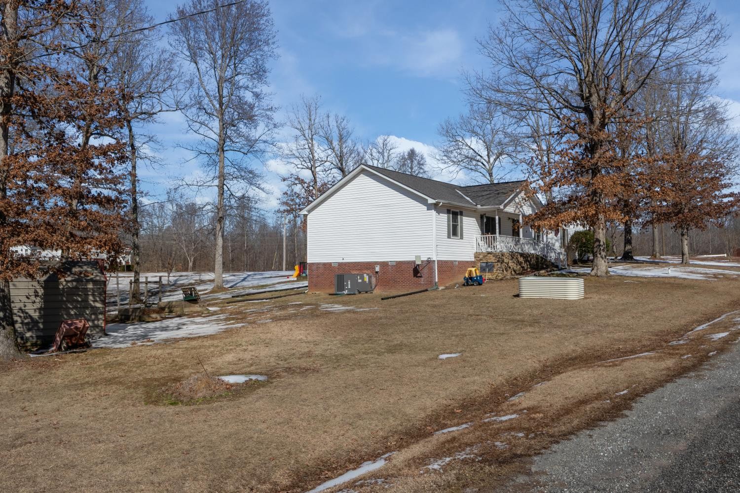 41 Golden Pond Circle Holladay, TN 38341 - Photo 38 of 42 a view of a house with a snow on the road