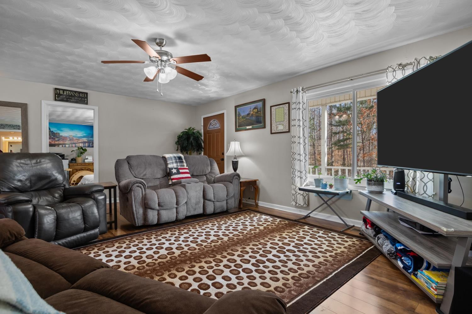 41 Golden Pond Circle Holladay, TN 38341 - Photo 6 of 42 a living room with furniture and a flat screen tv