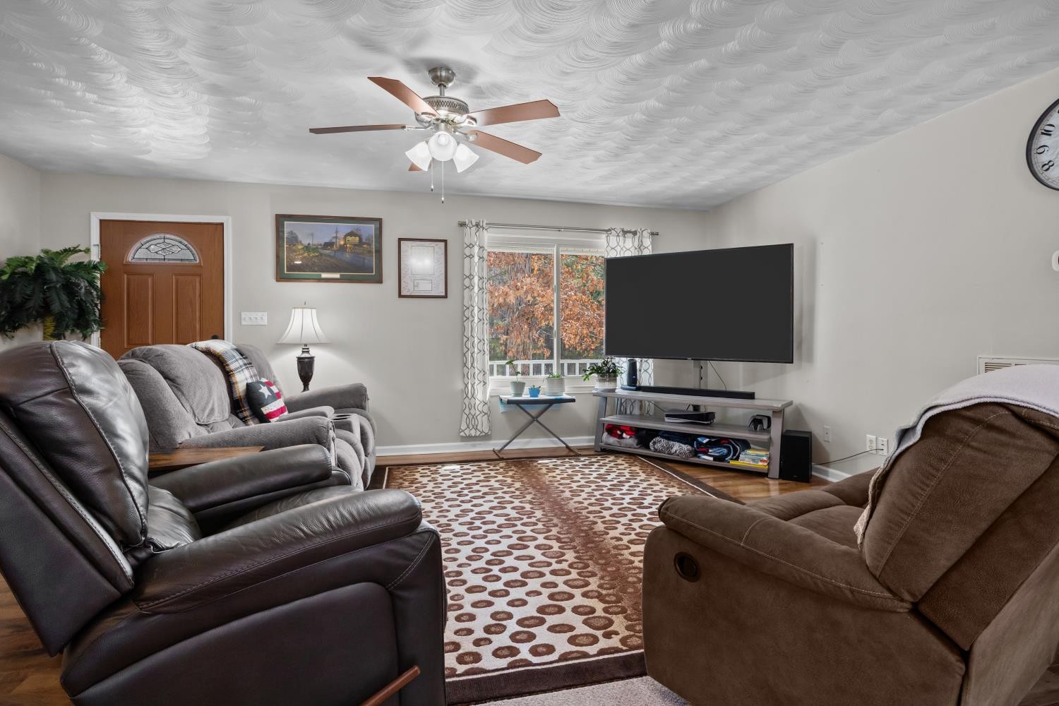 41 Golden Pond Circle Holladay, TN 38341 - Photo 9 of 42 a living room with furniture and a flat screen tv