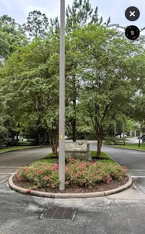 a view of a garden with a fountain
