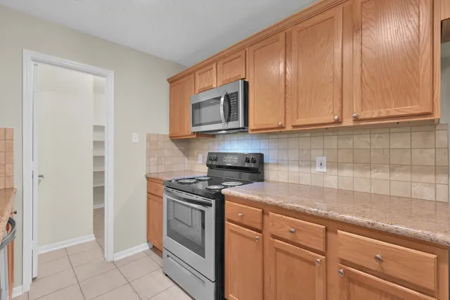 a kitchen with a sink and a window