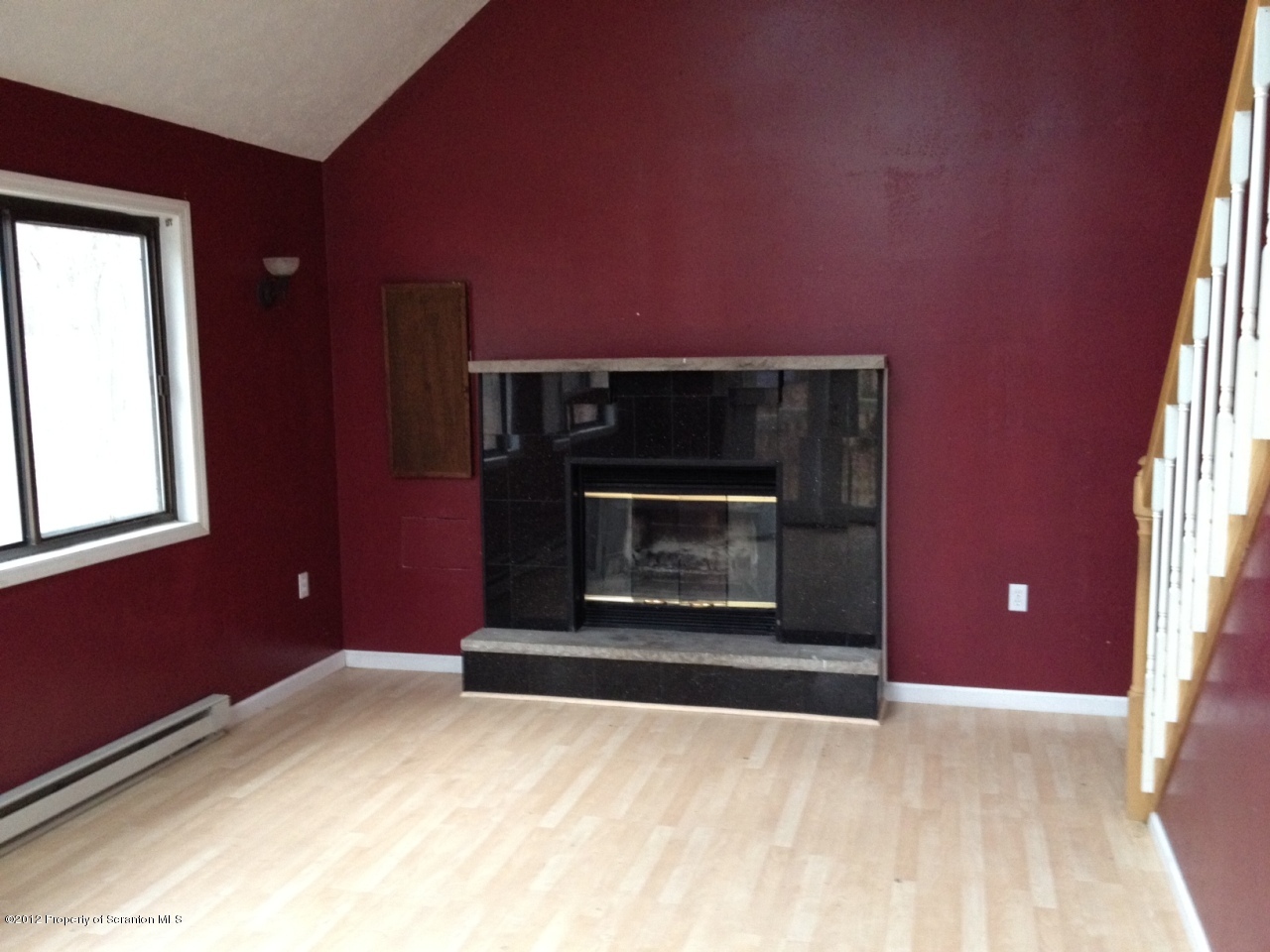 201 Butternut Road Milford, PA 18337 - Photo 6 of 10 a view of empty room with window and fireplace