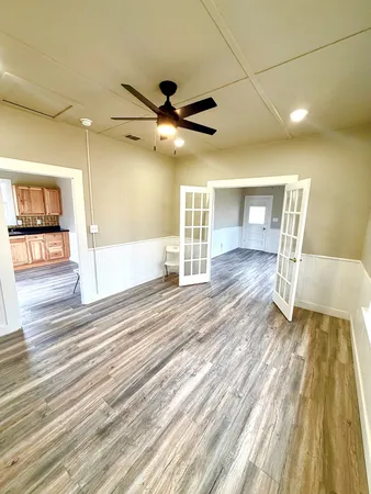 a view of a livingroom with wooden floor