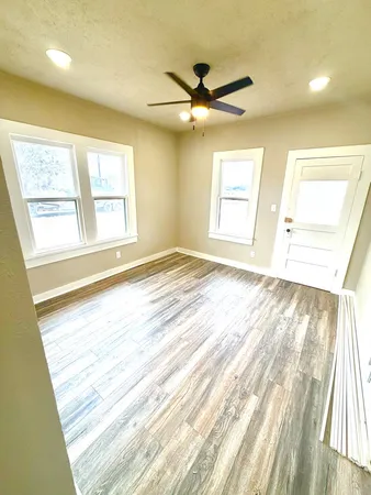 a view of an empty room and a window