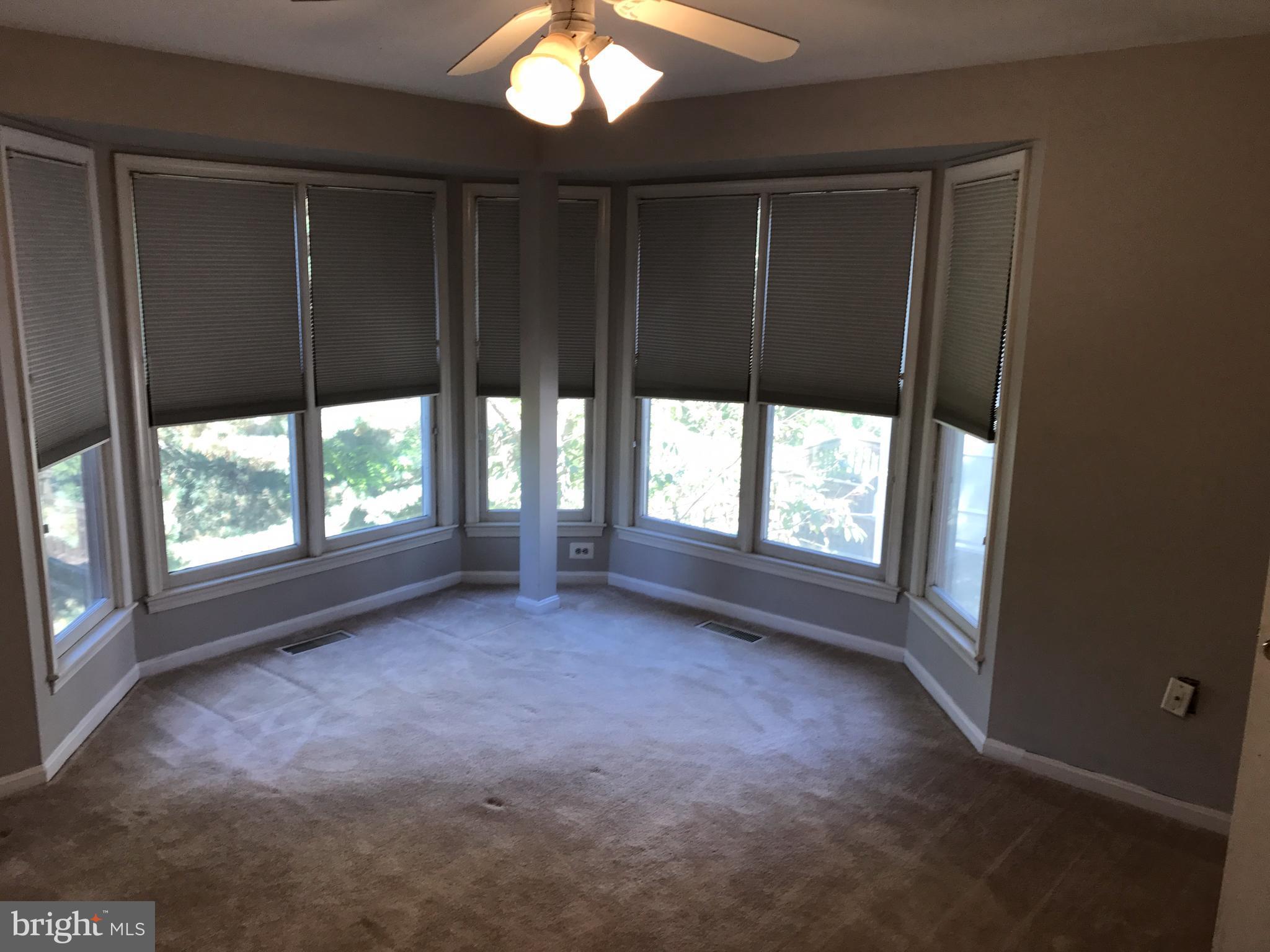 1717 Whisperhill Drive Reston, VA 20194 - Photo 6 of 10 en empty room with windows and yard