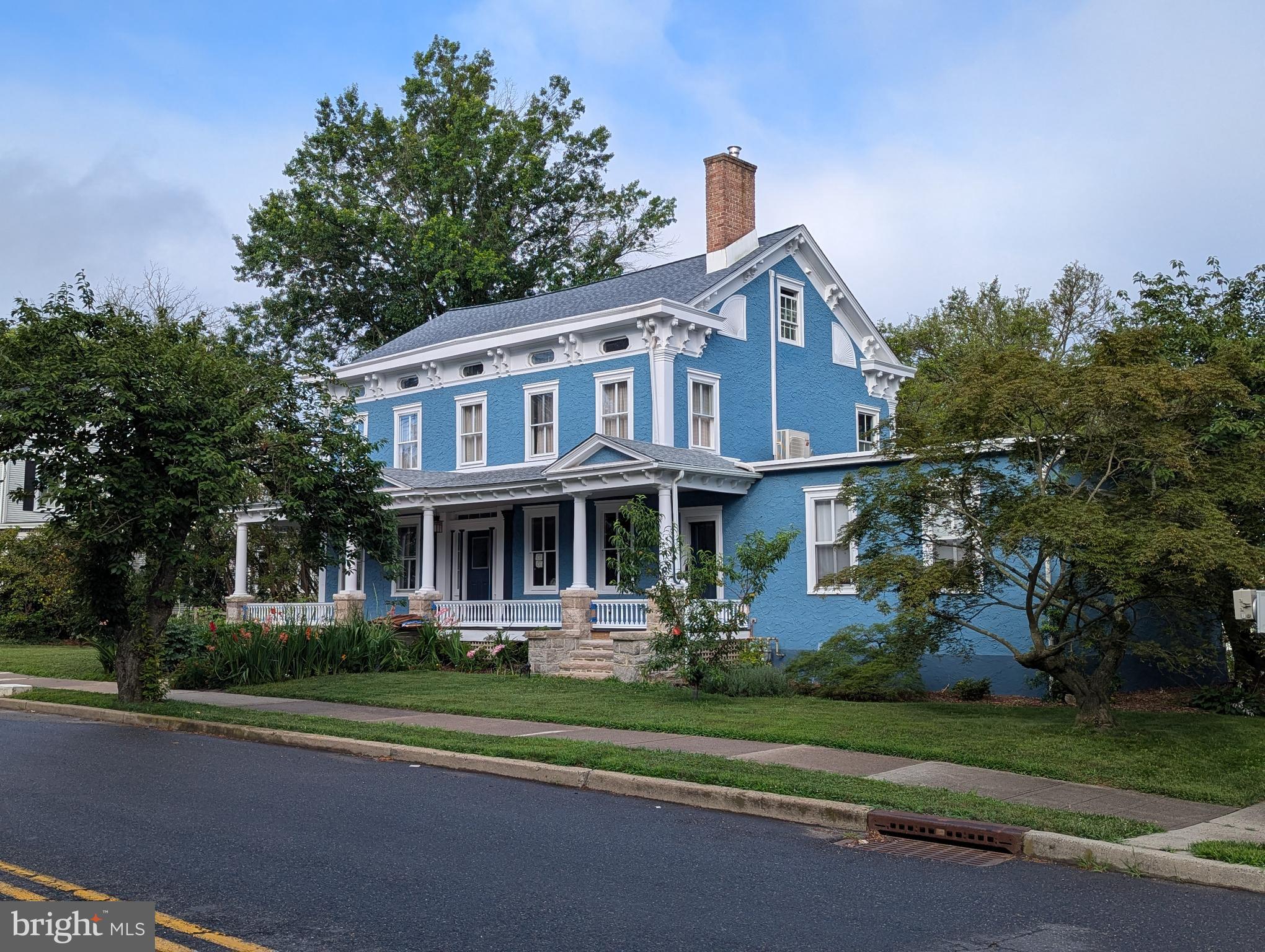 302 South Main Street Hightstown, NJ 08520 - Photo 1 of 39 a front view of a house with a yard
