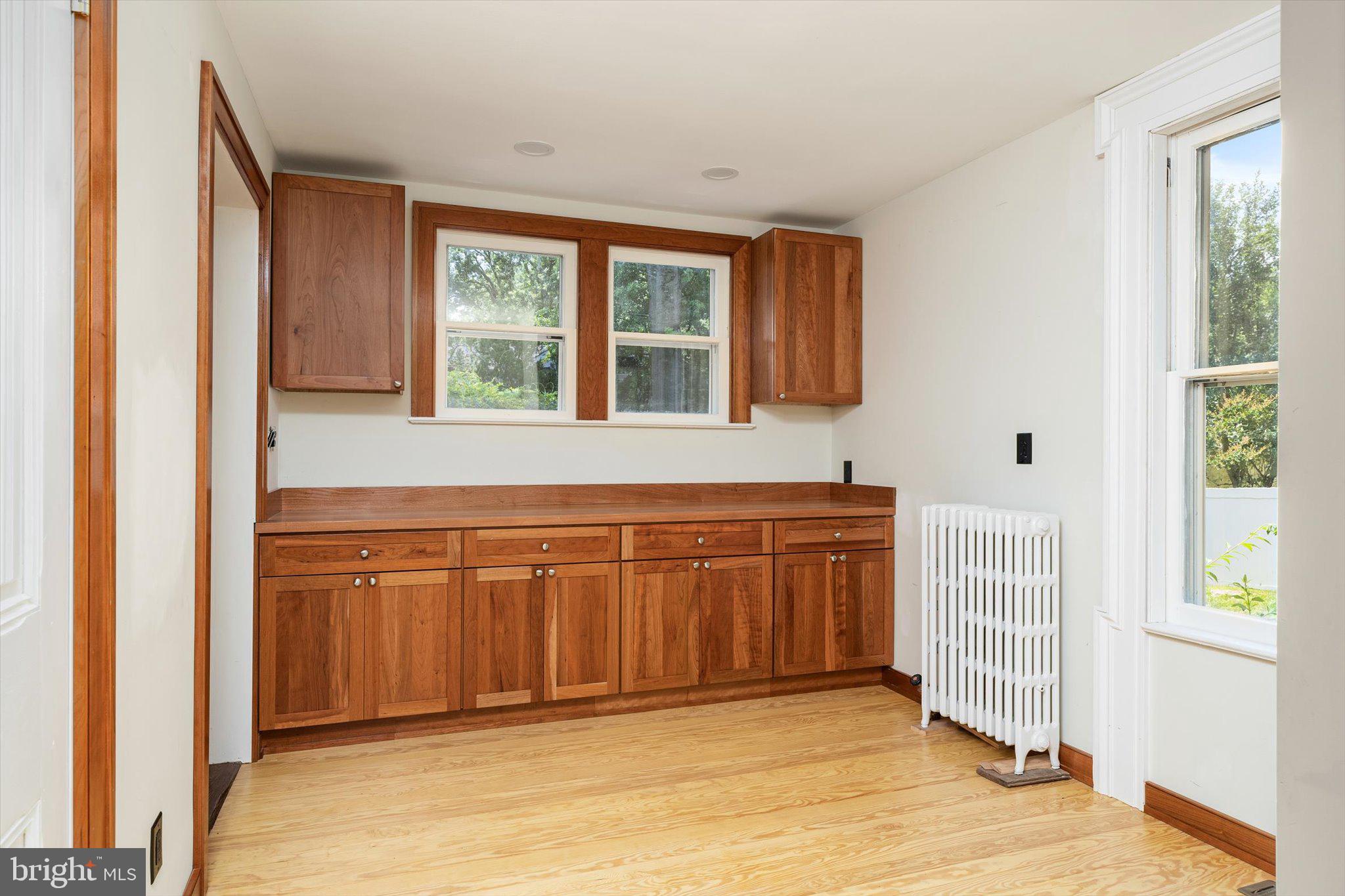 302 South Main Street Hightstown, NJ 08520 - Photo 11 of 39 a view of a kitchen with wooden floor and cabinet