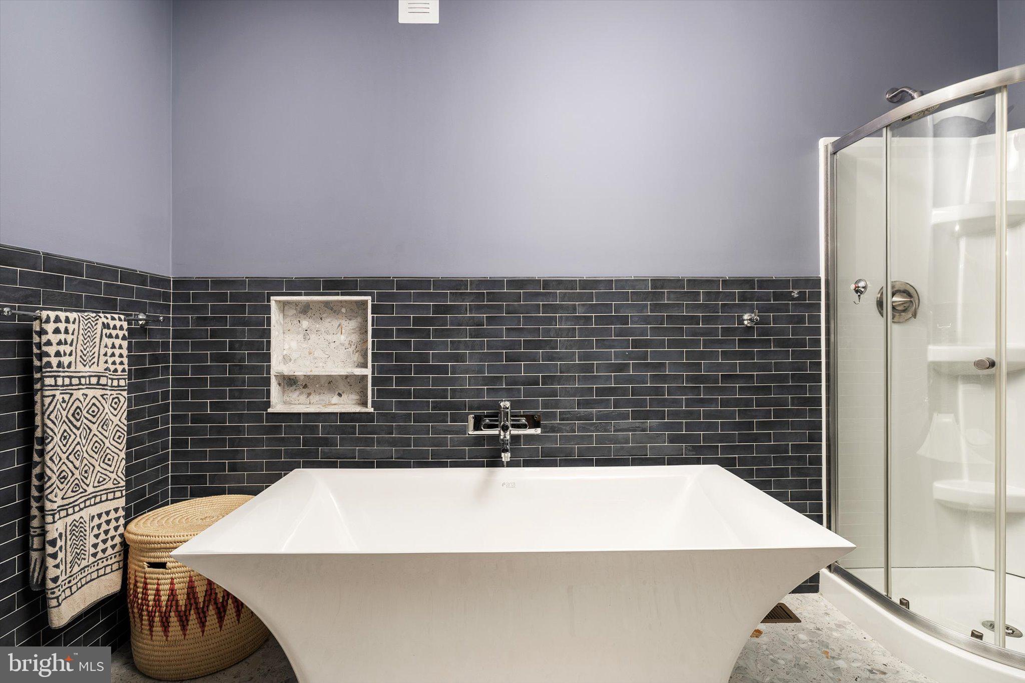 302 South Main Street Hightstown, NJ 08520 - Photo 13 of 39 a bathroom with a bathtub and shower