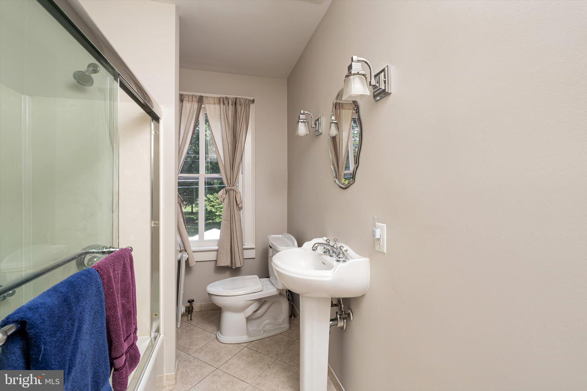 302 South Main Street Hightstown, NJ 08520 - Photo 18 of 39 a bathroom with a sink toilet and shower