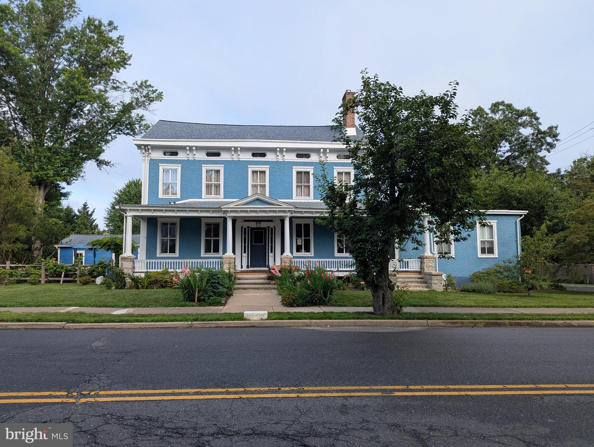 302 South Main Street Hightstown, NJ 08520 - Photo 2 of 39 a front view of a house with a garden