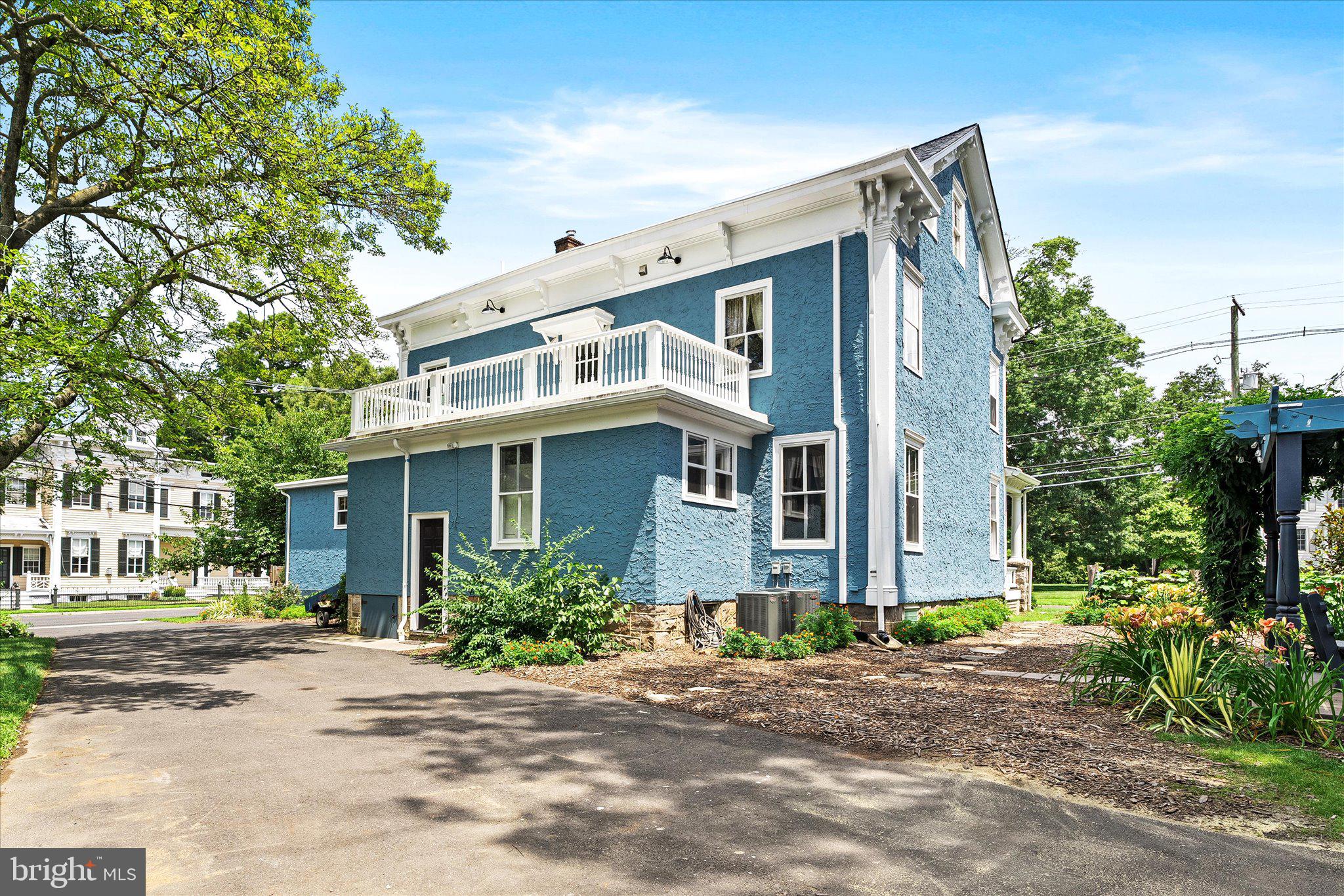 302 South Main Street Hightstown, NJ 08520 - Photo 26 of 39 a front view of a house with plants and trees
