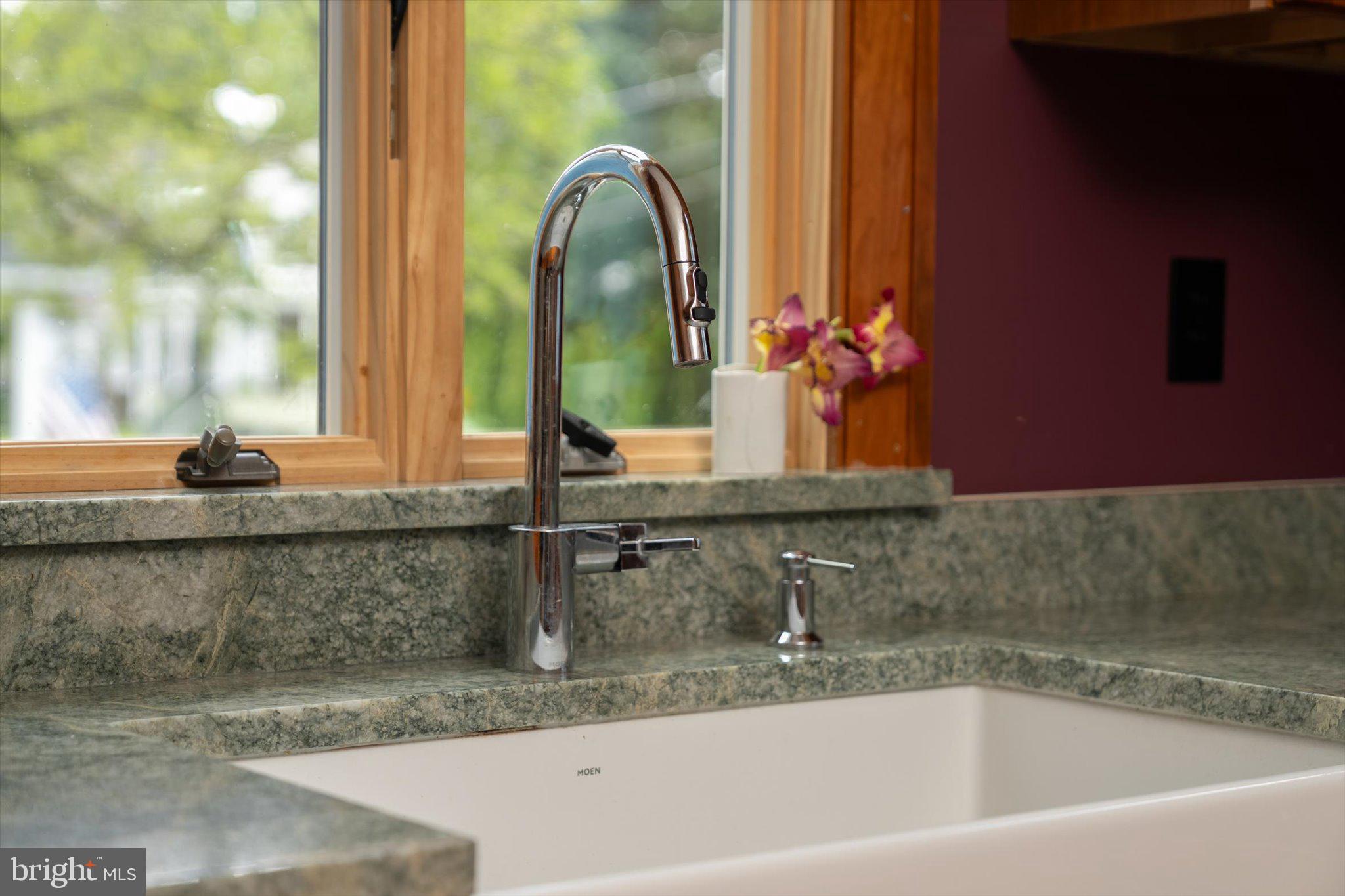 302 South Main Street Hightstown, NJ 08520 - Photo 35 of 39 a bathroom with a granite countertop sink and a mirror