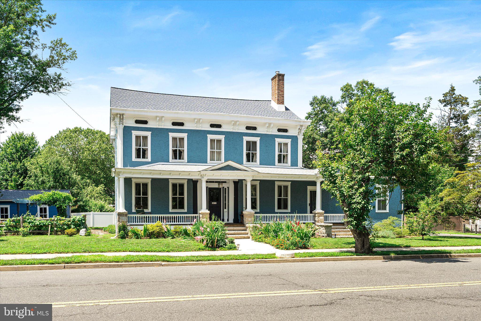 302 South Main Street Hightstown, NJ 08520 - Photo 39 of 39 a front view of a house with a garden and plants