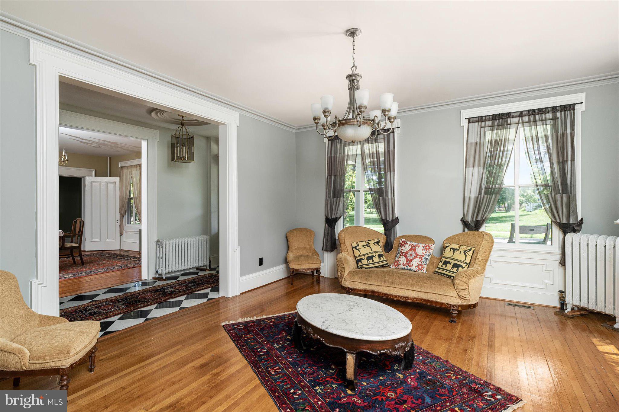 302 South Main Street Hightstown, NJ 08520 - Photo 8 of 39 a living room with furniture a flat screen tv and a window