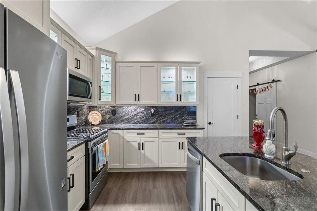 113 Hemingway Lane Coraopolis, PA 15108 - Photo 13 of 44 a kitchen with stainless steel appliances granite countertop a sink stove and refrigerator