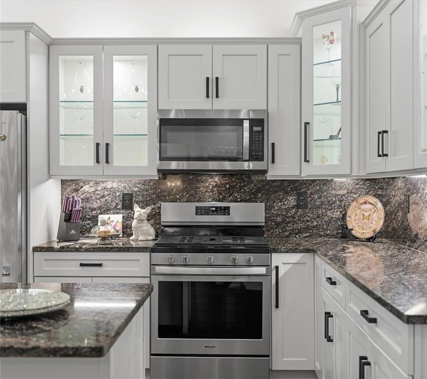 113 Hemingway Lane Coraopolis, PA 15108 - Photo 15 of 44 a kitchen with granite countertop cabinets stainless steel appliances and a counter space