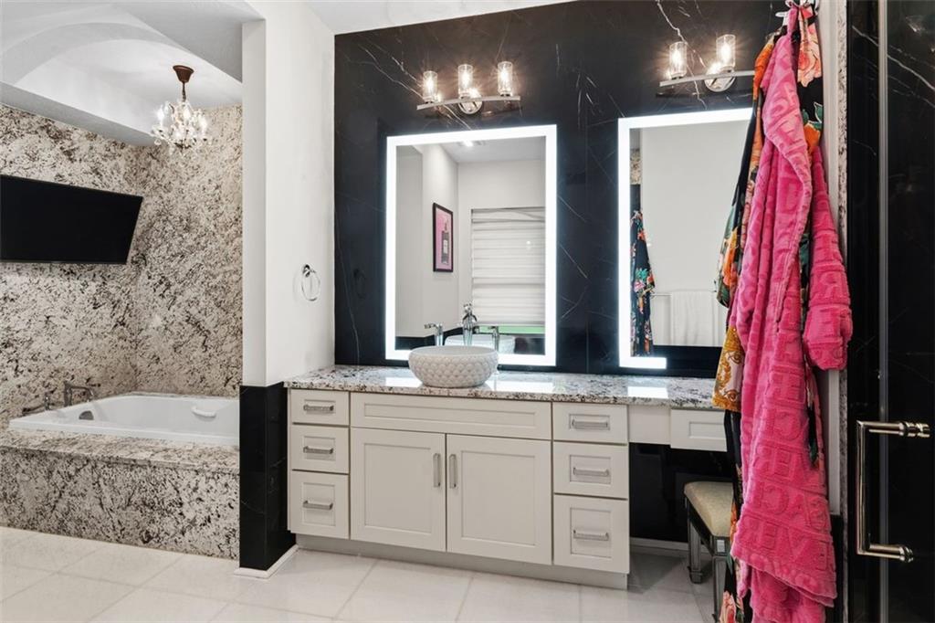 113 Hemingway Lane Coraopolis, PA 15108 - Photo 24 of 44 a bathroom with a bathtub sink and mirror