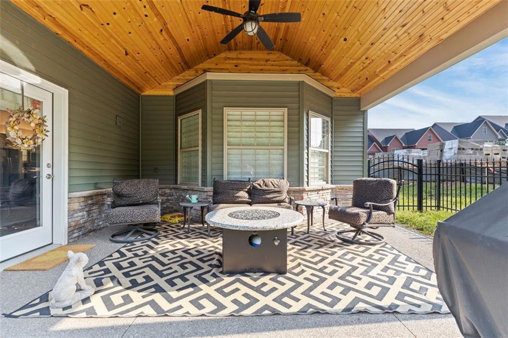 113 Hemingway Lane Coraopolis, PA 15108 - Photo 30 of 44 a living room with furniture a rug and a chandelier