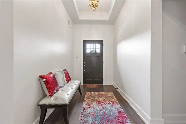 a living room with furniture and a rug