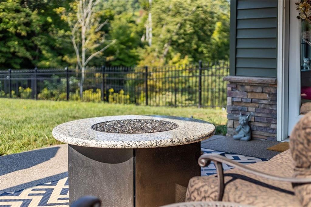 113 Hemingway Lane Coraopolis, PA 15108 - Photo 32 of 44 a view of a patio with a table and chairs