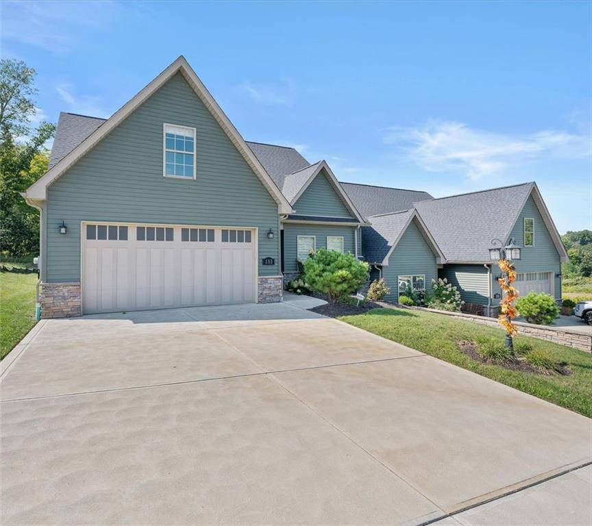 113 Hemingway Lane Coraopolis, PA 15108 - Photo 43 of 44 front view of a house with a yard and potted plants