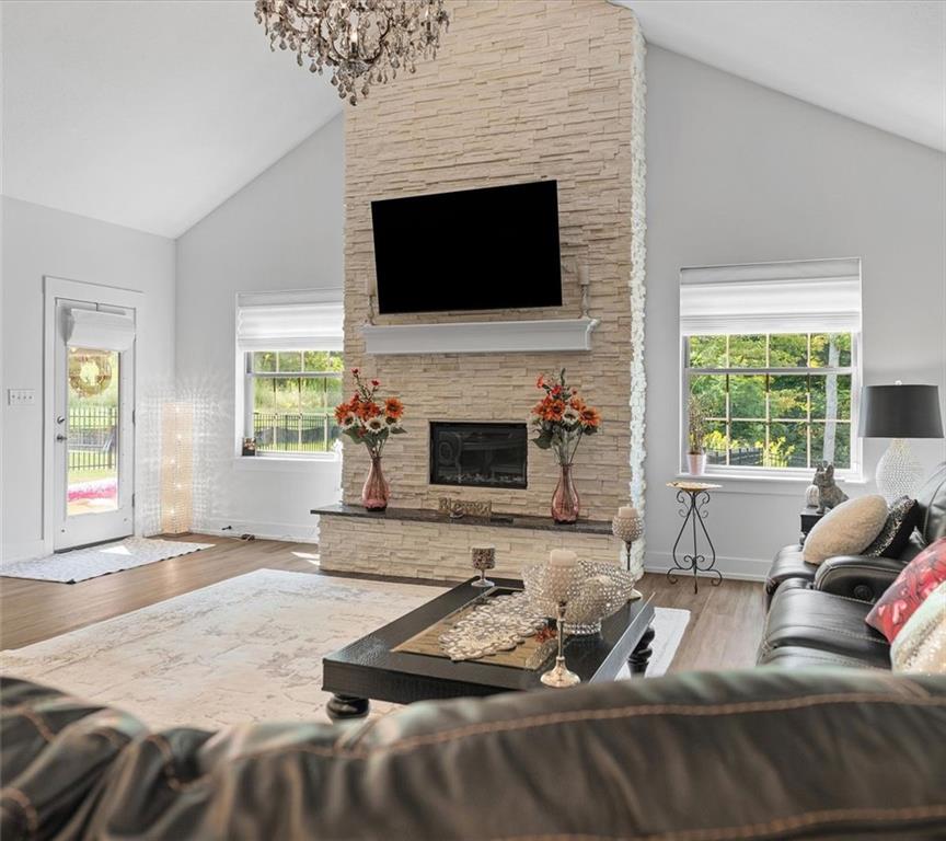 113 Hemingway Lane Coraopolis, PA 15108 - Photo 7 of 44 a living room with furniture a fireplace and a flat screen tv
