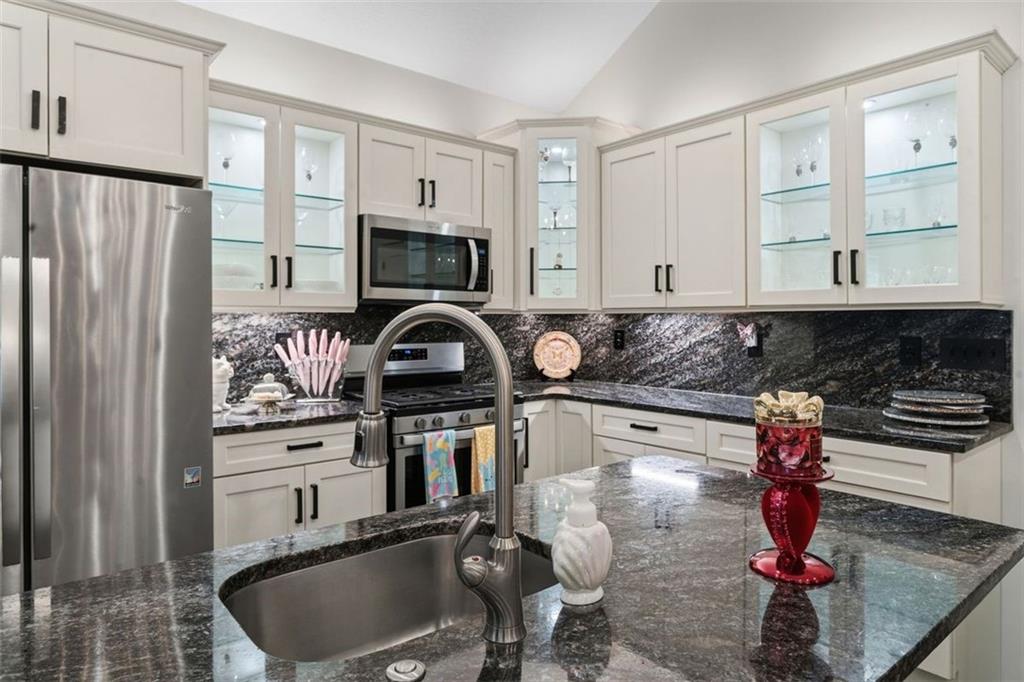 113 Hemingway Lane Coraopolis, PA 15108 - Photo 9 of 44 a kitchen with stainless steel appliances granite countertop a sink stove and refrigerator