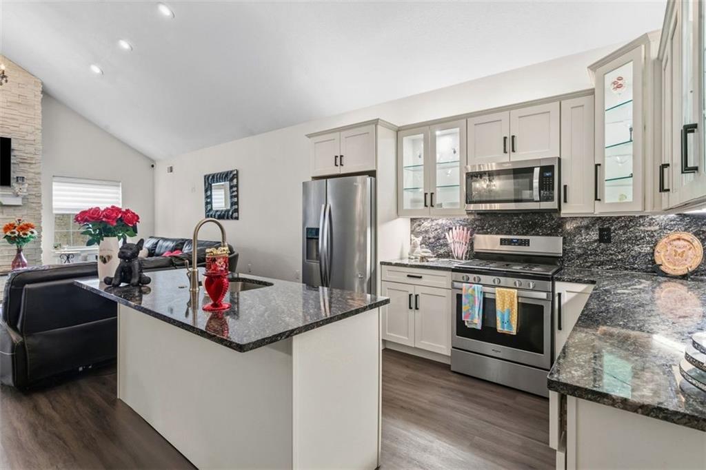 113 Hemingway Lane Coraopolis, PA 15108 - Photo 10 of 44 a kitchen with stainless steel appliances granite countertop a sink refrigerator and microwave