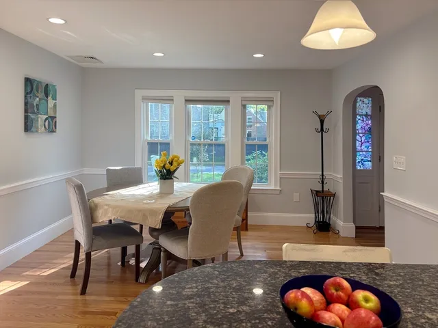 a dining room with furniture and window